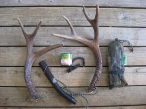 Shed black-tailed deer antlers for rattling are seen with a variety of calls and a rattling bag.